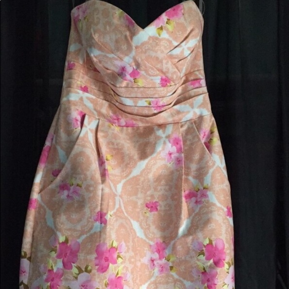 A strapless flowered dress , worn once